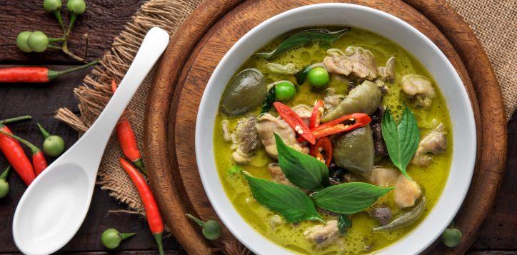 thai-food-chicken-green-curry-on-dark-wooden-background-top-view